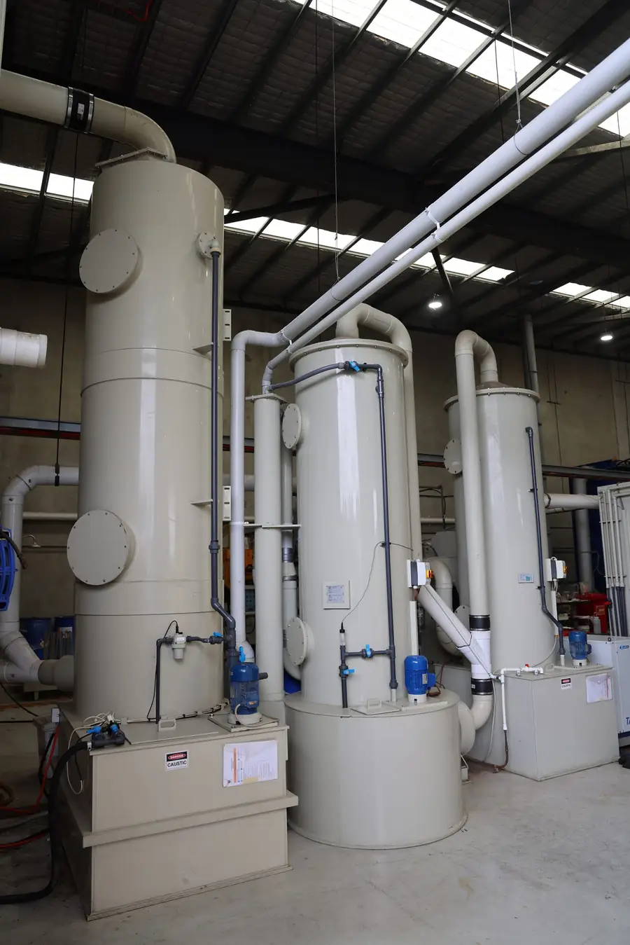 Three-stage acid fume scrubbing towers