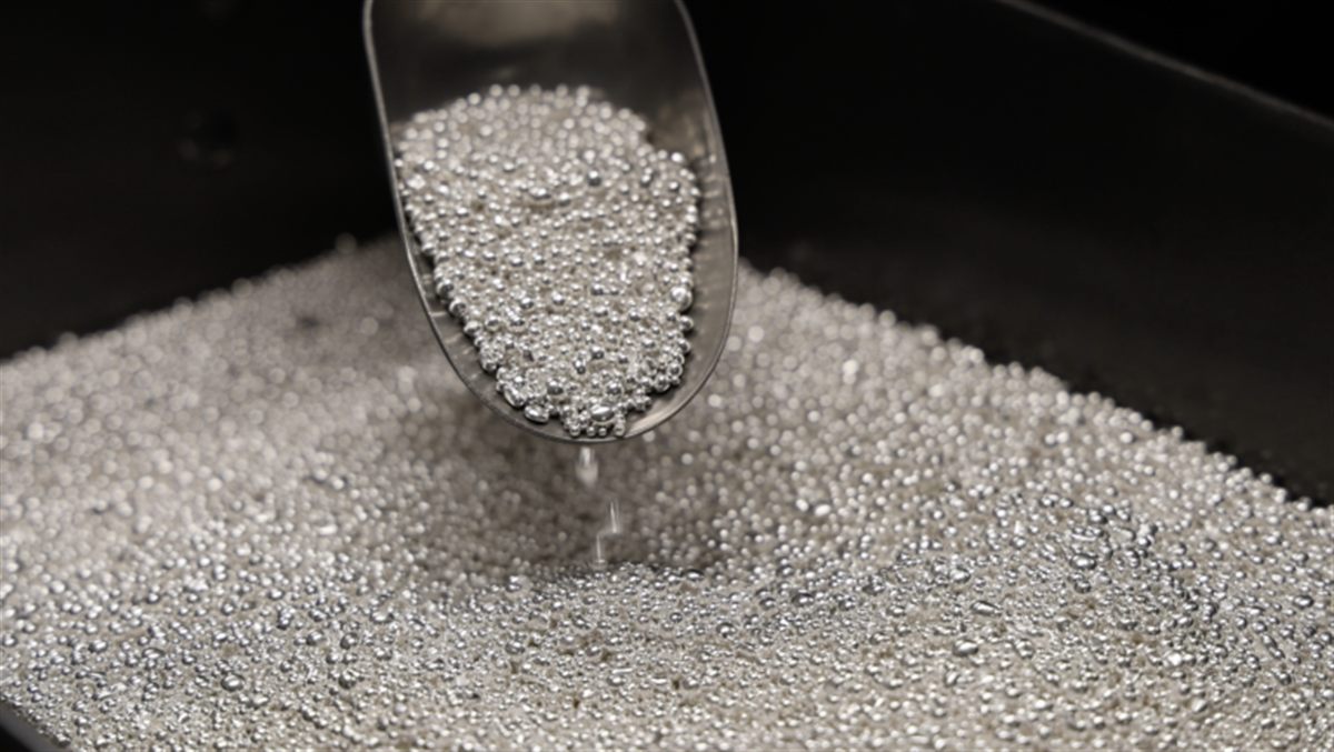 Fine silver granules being scooped